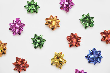 Festive colorful bows on white background. Holiday background. Christmas concept.