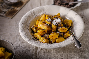 Pumpkin dumplings with poppy seeds and butter