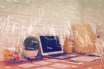 Financial graph colorful drawing and table with computer on background. Double exposure. Concept of...