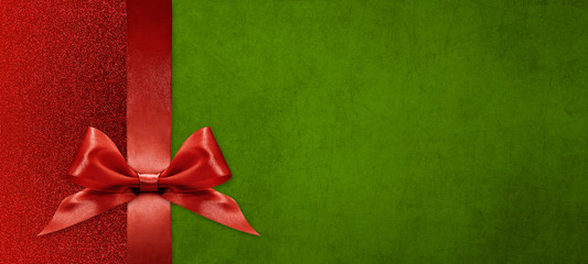 gift card wishes merry christmas background with red ribbon bow on green shiny vibrant color...