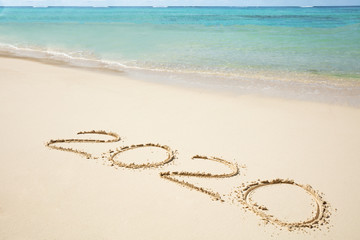 2020 Year Written On Sand Near The Sea At Beach