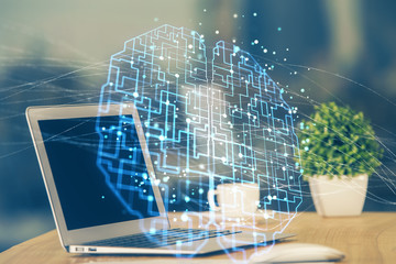 Double exposure of table with computer and brain hologram. Data innovation concept.
