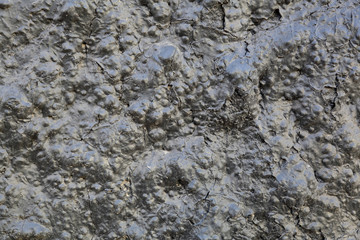 Black textured surface of volcanic lava as an element of design and decoration