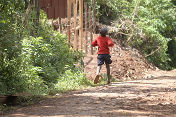 boy running on a trail