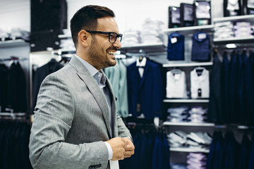 Smiling Young Man Enjoying Shopping