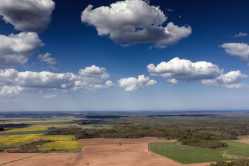 Fototapeta na wymiar Cloudy sky over countryside landscape.