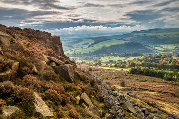 Stunning Autumn Fall landscape image of countryside view from Curbar Edge in Peak District England at sunset