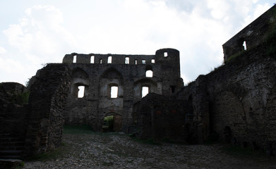 Looking up at castle walls with black and white filter