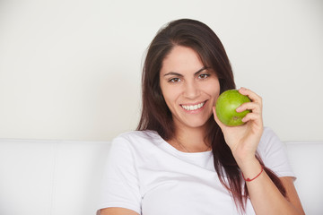 pretty woman holding green apple