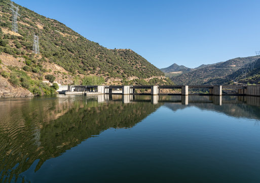Solid structure of the Valeira dam on River Dourowith lock and gates on the left