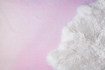 Background with white and pink sheep skin, wool texture