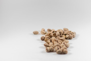 Pile of Organic Pistachios on White Background