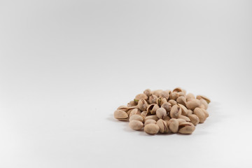 Pile of Organic Pistachios on a White Background