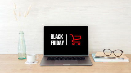 Black Friday concept. Laptop screen with text sign 