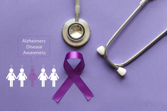 Stethoscope and person with purple ribbon on purple background, Symbol of Alzheimers awareness, Healthcare and medicine concept.