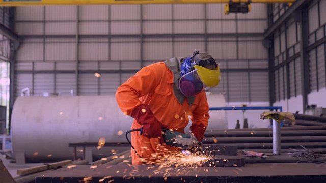  Footage welder welding pipe in workshop .