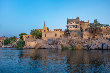 Fototapeta na wymiar Houses and mosque on the bank of Nile river in Aswan, Egypt