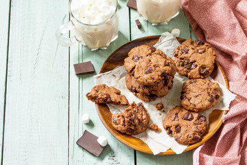 Baked Christmas cookies. Homemade Chocolate Chip Cookies on a light stone table. Free space for your text.