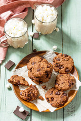 Baked Christmas cookies. Homemade Chocolate Chip Cookies on a light stone table.