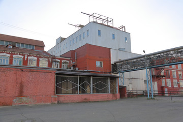 A dilapidated brick building of an old factory of the last century