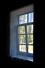 Window with white curtains.
