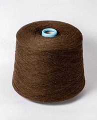bobbin of yarn on a white background. Side view.Textile reel on isolated white background.