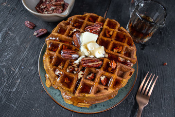 pumpkin waffles with pecans topped with butter and syrup flat lay - obrazy, fototapety, plakaty