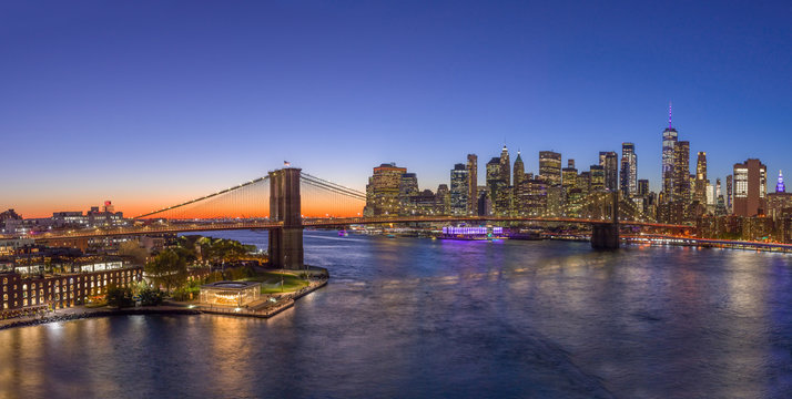 Fototapeta New York City downtown buildings skyline Brooklyn Bridge sunset evening night