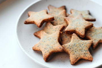  Star-shaped cookies on a white plate.