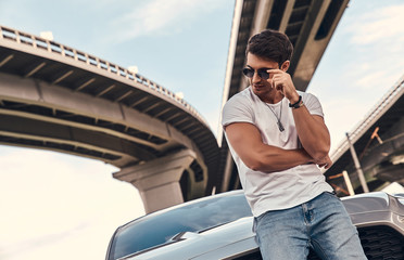 Handsome man near car