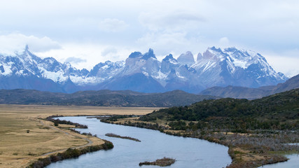 Fototapeta na wymiar The Rio Serrano and the plains below the mountains of the Torres del Paine, Torres del Paine National Park, Chile