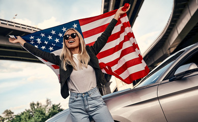 Young woman near car