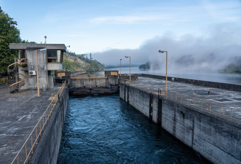 Filled lock as cruise boat leaves the Crestuma Lever dam on River Douro in Portugal