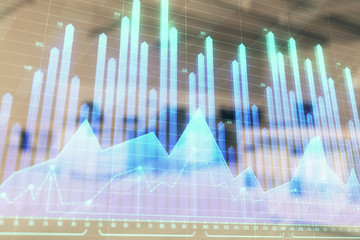 Stock market chart with trading desk bank office interior on background. Double exposure. Concept of financial analysis