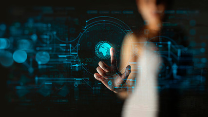 Businesswoman touching global network and data exchanges over the world with new technology interface.