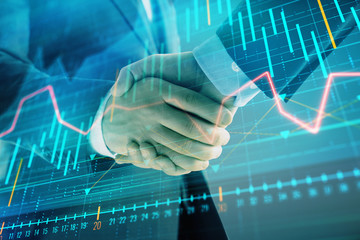 Multi exposure of forex graph on abstract background with two businessmen handshake. Concept of success on stock market