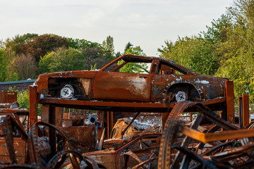 rusted burnt out car wrecks