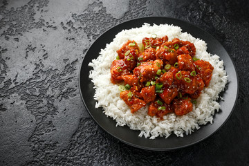 Tso's chicken with rice, green onion and broccoli