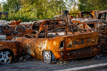 rusted burnt out car wrecks