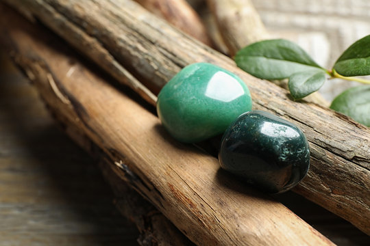 Beautiful green aventurin and heliotrope gemstones with wooden sticks