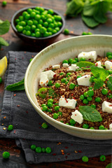 Quinoa salad with green pea, mint, feta cheese and chilli flake. healthy diet food
