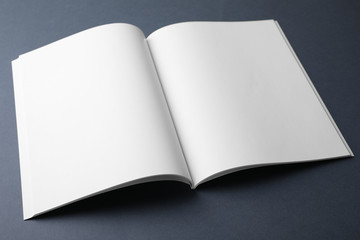 Blank book on dark grey background. Mock up for design