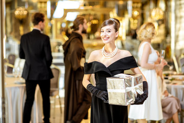 Portrait of an elegant woman celebrating a New Year holiday indoors