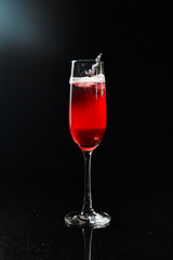 Sweet red berry summer cocktail on the bar counter..