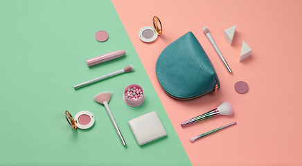 Cosmetic makeup accessories layout. Fashion creative minimal Set. Trendy Design Clutch, lipstick brushes. Art Concept colorful pastel Style. Beauty cosmetic make up tools, fashionable flat lay