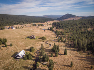 Aerial of small willage in wild mountains nature 