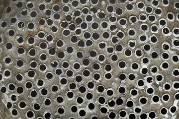 Holes in aluminum. Randomly holes in metal. Texture metal holes.