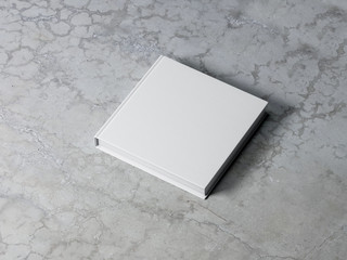 White square blank Book Mockup with textured hard cover on concrete background