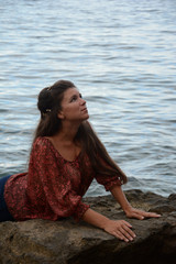 Happy woman relaxing and enjoying at the beach during travel holidays vacation outdoors at ocean or nature sea