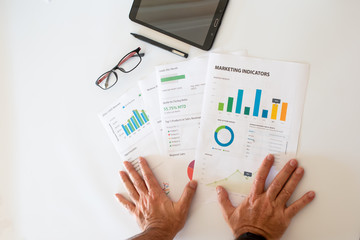 Financial,accounting,investment document on office desk with digital tablet, pen and glasses